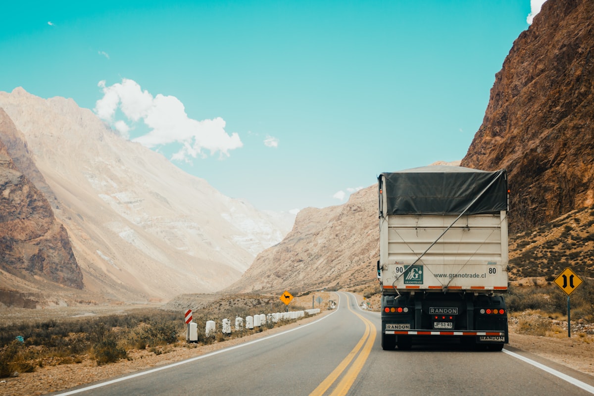 Truck driver on the open road with trip tracking technology